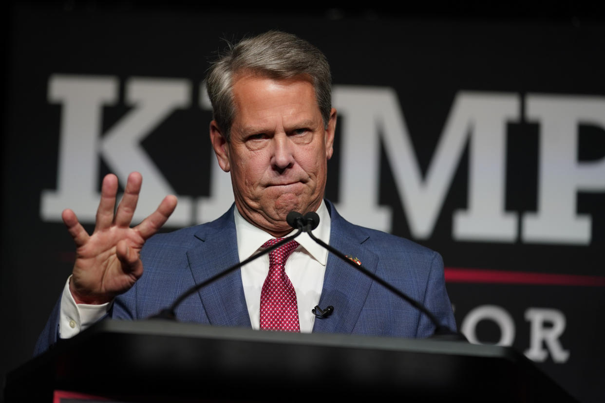 Republican Gov. Brian Kemp holds his fingers out denoting four more years in front of supporters during an election night watch party, Tuesday, May 24, 2022, in Atlanta. (AP Photo/John Bazemore)