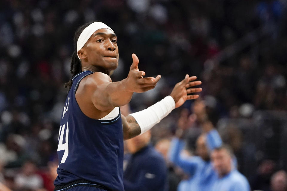 Los Angeles Clippers guard Terance Mann reads after a 3-point basket during the first half of an NBA basketball game against the Memphis Grizzlies, Sunday, Nov. 12, 2023, in Los Angeles. (AP Photo/Ryan Sun)