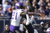 FILE - Minnesota Vikings cornerback Akayleb Evans (21) is called for interference on Chicago Bears wide receiver Tyler Scott during the second half of an NFL football game, Sunday, Oct. 15, 2023, in Chicago. Social media is the proverbial double-edged sword. “We're trying to put our best foot forward on the field, but people are going to mess up,” Evans said. “You’re not always going to be at your best every game. People just have to realize the human side of everything." (AP Photo/Charles Rex Arbogast, File)