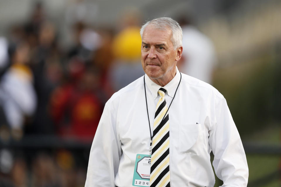 FILE - In this Sept. 14, 2019, file photo, Iowa athletic director Gary Barta walks on the field before an NCAA college football game against Iowa State in Ames, Iowa. The University of Iowa said it would not pay a demand from eight Black former football players for $20 million in compensation for alleged racial discrimination they faced while they played for the Hawkeyes. The players also called for the firings of head football coach Kirk Ferentz, offensive line coach Brian Ferentz and Barta. (AP Photo/Charlie Neibergall, File)