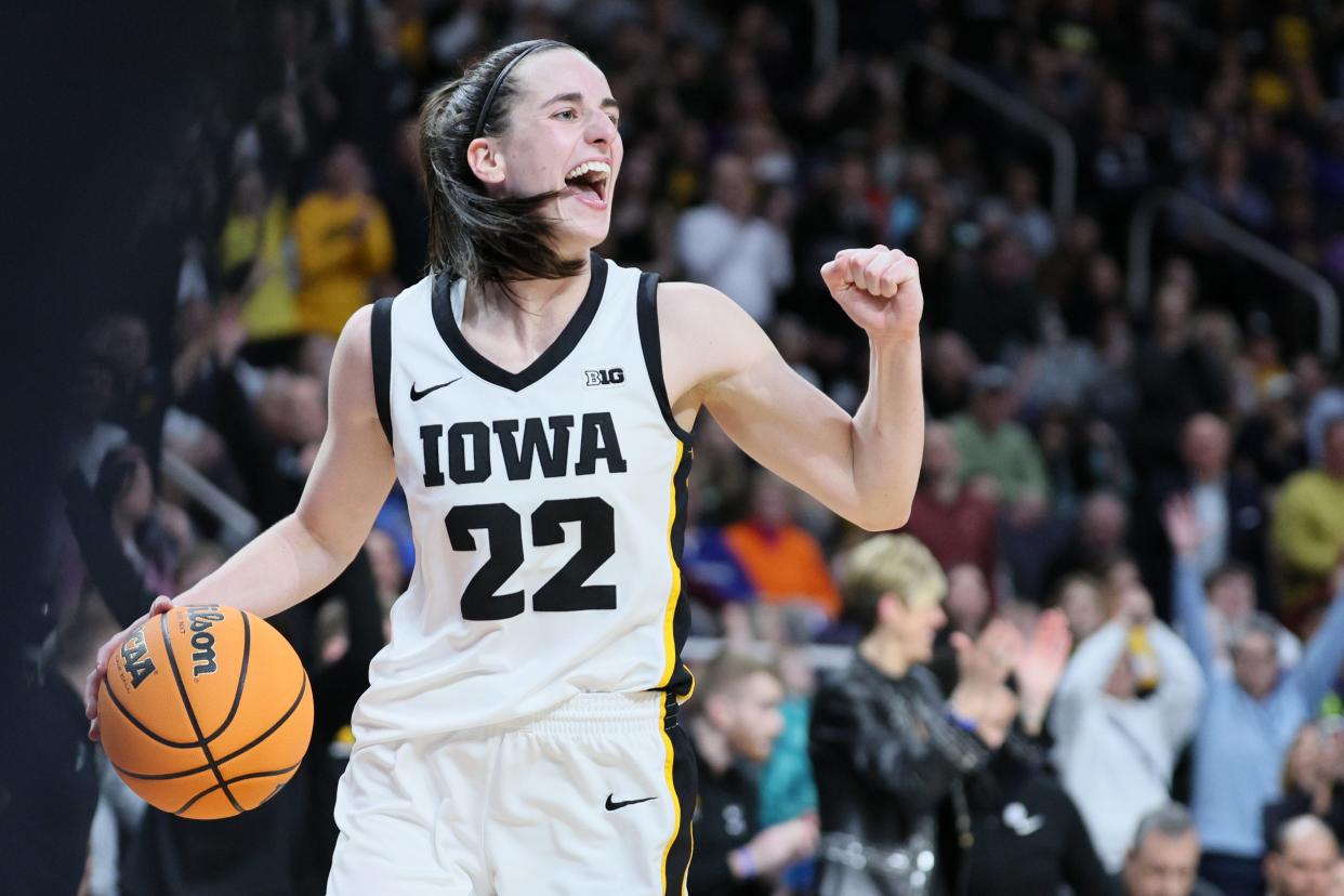 :Caitlin Clark of the Iowa Hawkeyes celebrates after beating the LSU Tigers 94-87 in the Elite 8 round of the NCAA Women's Basketball Tournament.