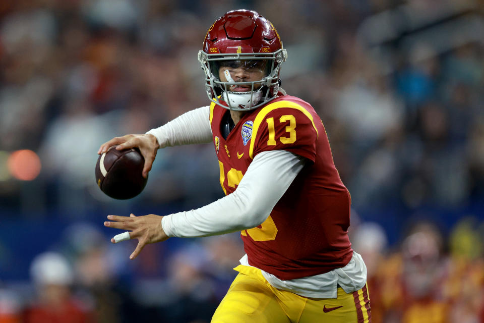 ARLINGTON, TEXAS – JANUARY 02: Caleb Williams #13 of the USC Trojans throws a touchdown pass against the Tulane Green Wave in the second quarter of the Goodyear Cotton Bowl Classic on January 02, 2023 at AT&T Stadium in Arlington, Texas. (Photo by Tom Pennington/Getty Images)