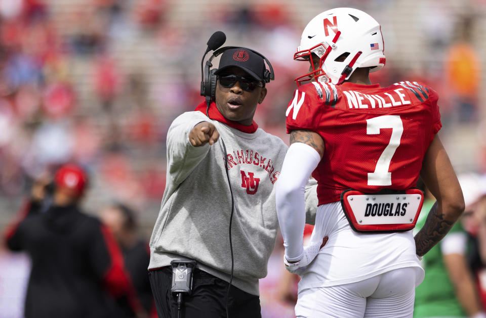 FILE - Then-Nebraska associate head coach and wide receivers/passing game coordinator Mickey Joseph chats with red team wide receiver Latrell Neville (7) during the second half of Nebraska's NCAA college football annual red-white spring game at Memorial Stadium in Lincoln, Neb., Saturday, April 9, 2022. Mickey Joseph begins his run as Nebraska's interim head coach following Scott Frost's firing. (AP Photo/Rebecca S. Gratz, File)