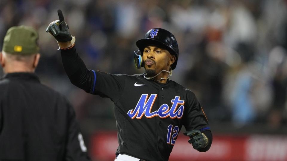 New York Mets shortstop Francisco Lindor (12) reacts to hitting a home run as he rounds the bases against the Cleveland Guardians during the sixth inning at Citi Field