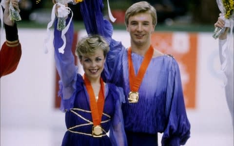 The real Torvill and Dean celebrate their gold medals at the 1984 Winter Olympics in Sarajevo, Yugoslavia - Credit: Steve Powell/Getty Images
