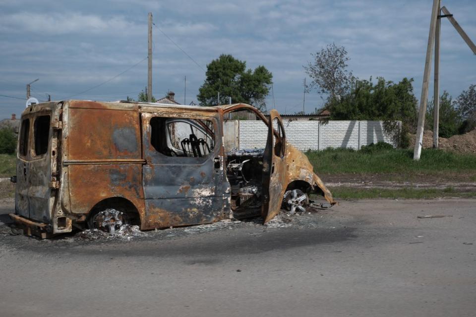 A destroyed minivan on the streets of Vovchansk, Kharkiv Oblast, on May 11, 2024. (Francis Farrell/The Kyiv Independent)