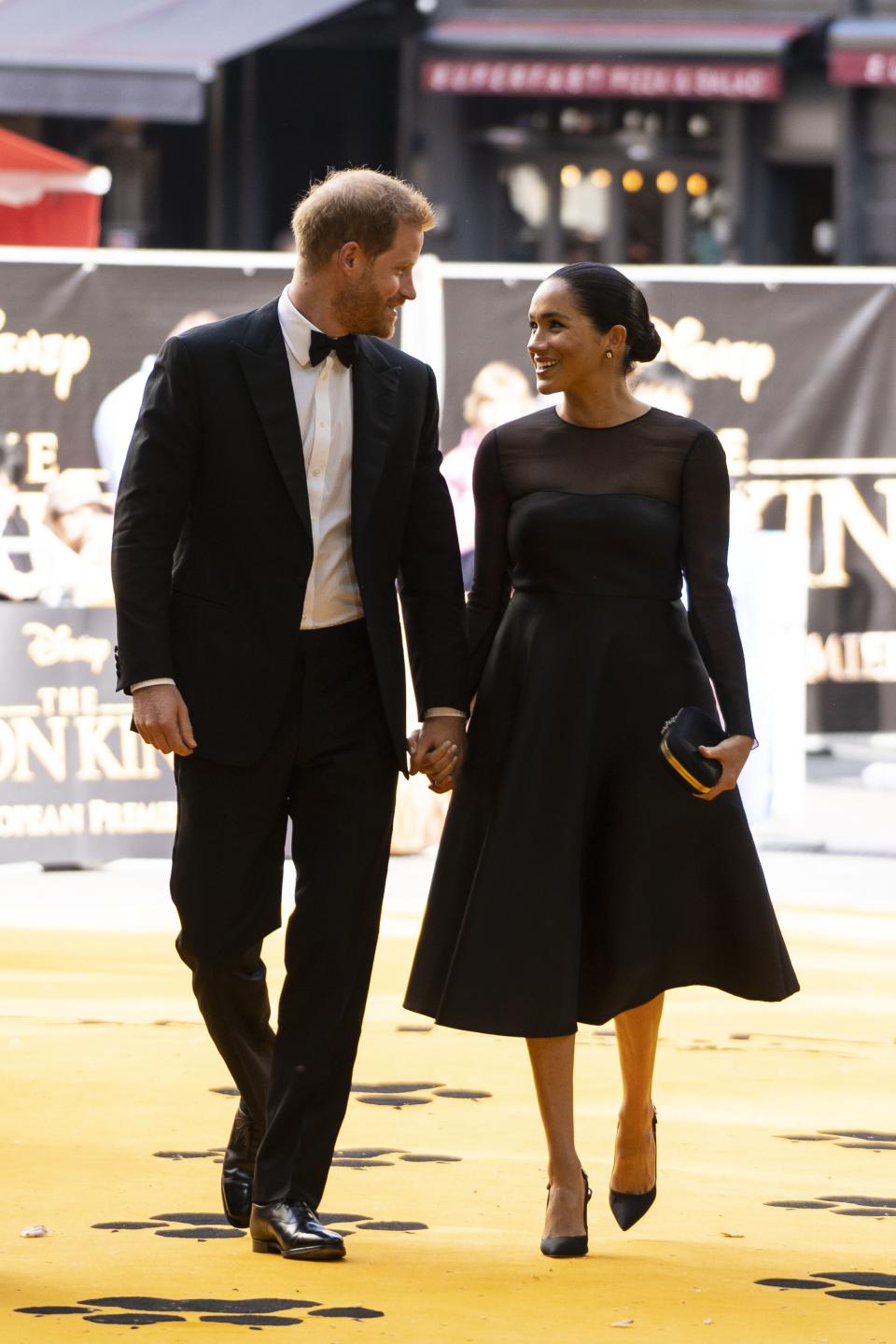 Britain's Prince Harry, Duke of Sussex (L) and Britain's Meghan, Duchess of Sussex (R) arrive to attend the European premiere of the film The Lion King in London on July 14, 2019. (Photo by Niklas HALLE'N / POOL / AFP)        (Photo credit should read NIKLAS HALLE'N/AFP/Getty Images)