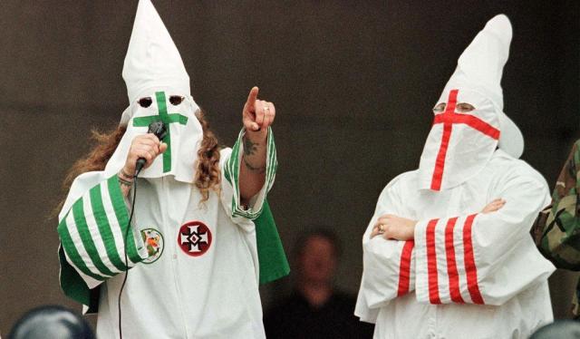 Three teenagers in Texas dressed in KKK garb for Halloween before