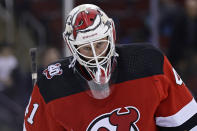 New Jersey Devils goaltender Vitek Vanecek reacts as he skates off the ice after the third period of an NHL hockey game against the Tampa Bay Lightning on Tuesday, March 14, 2023, in Newark, N.J. The Lightning won 4-1. (AP Photo/Adam Hunger)