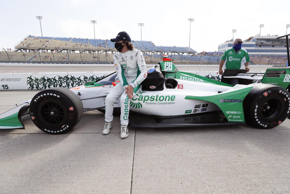 Colton Herta sits on his car during qualifying for an IndyCar Series auto race Friday, July 17, 2020, at Iowa Speedway in Newton, Iowa. (AP Photo/Charlie Neibergall)
