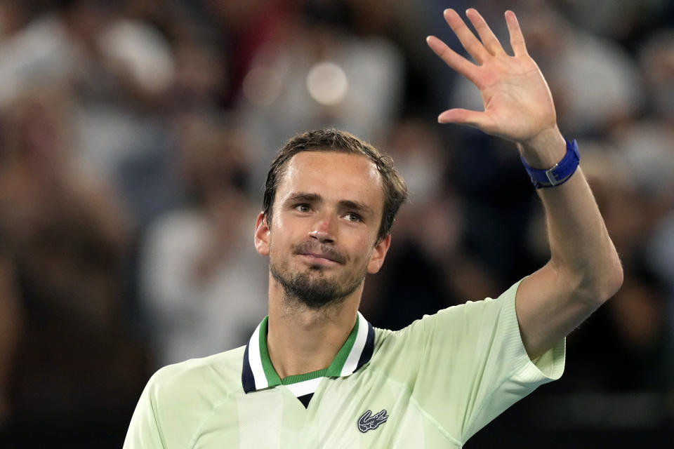 Daniil Medvedev of Russia waves after defeating Stefanos Tsitsipas of Greece in their semifinal match at the Australian Open tennis championships in Melbourne, Australia, Friday, Jan. 28, 2022. (AP Photo/Simon Baker)