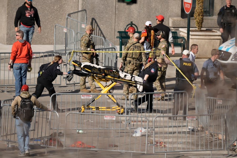 Emergency crew arrive at the scene after an incident following the Kansas City Chiefs victory parade in Kansas City, Mo., Wednesday, Feb. 14, 2024. The Chiefs defeated the San Francisco 49ers Sunday in the NFL Super Bowl 58 football game. (AP Photo/Charlie Riedel)