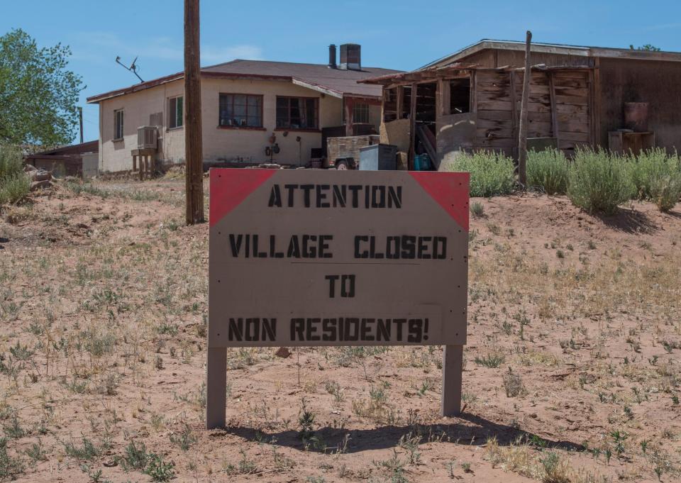FILE: A sign warning non residents to stay out in the Navajo Nation town of Tuba City during the 57 hour curfew, imposed to try to stop the spread of the Covid-19 virus through the Navajo Nation, in Arizona on May 24, 2020.  / Credit: MARK RALSTON/AFP via Getty Images