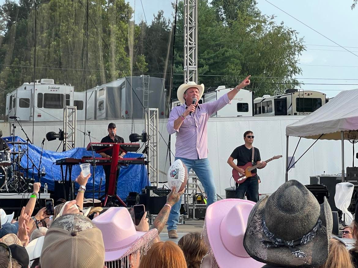 Tracy Byrd performs Friday during the Neon Nights country music festival. The event continues Saturday at Clay's Resort Jellystone Park in Lawrence Township in Stark County.
