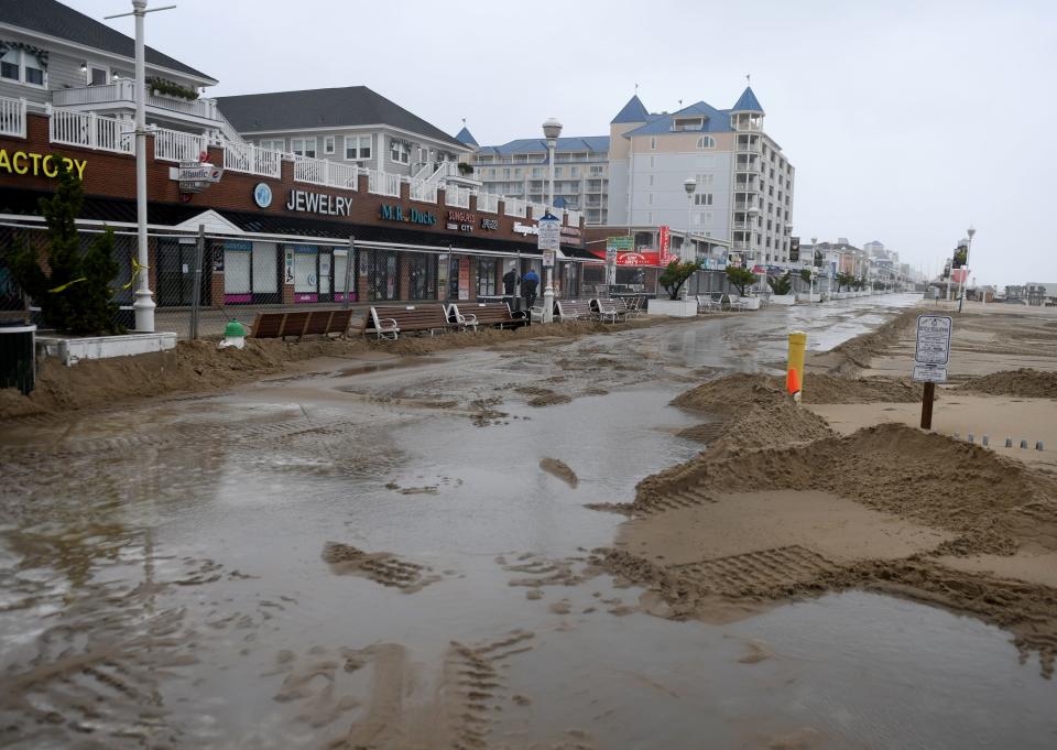 Wet sand covers the boardwalk next to Ripley's Believe it or Not Monday, Oct. 3, 2022, in Ocean City, Maryland.
