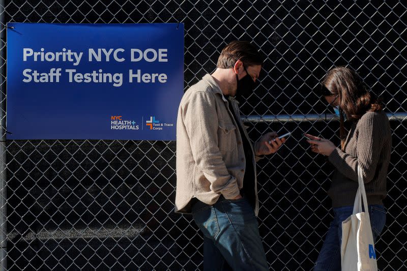 People wait in line to be tested for coronavirus disease (COVID-19) at a testing center in the Borough Park section of Brooklyn, New York