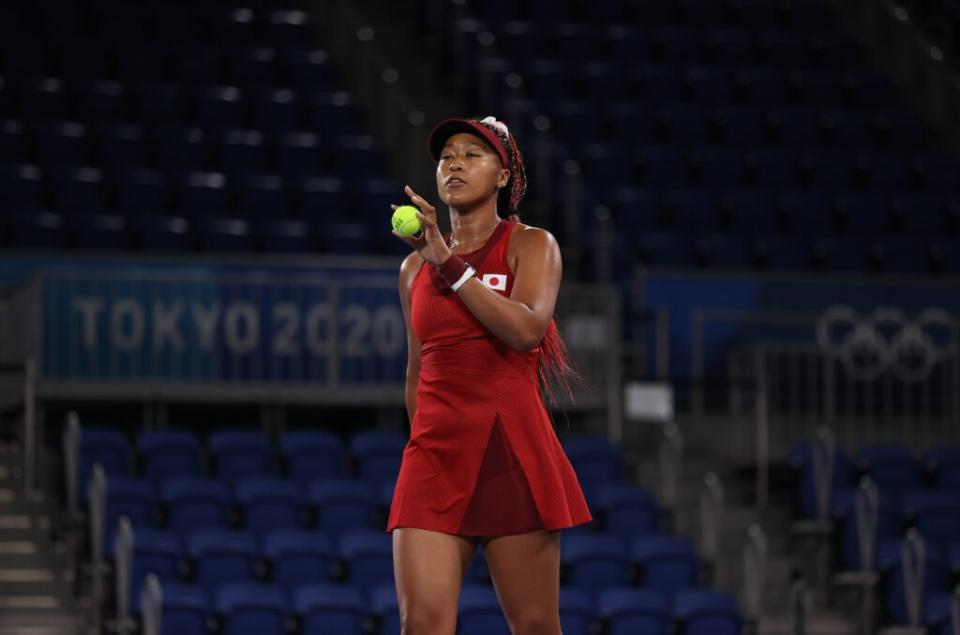 Naomi Osaka of Team Japan prepares to serve during her Women’s Singles Third Round match against <span class="caas-xray-inline-tooltip"><span class="caas-xray-inline caas-xray-entity caas-xray-pill rapid-nonanchor-lt" data-entity-id="Markéta_Vondroušová" data-ylk="cid:Markéta_Vondroušová;pos:2;elmt:wiki;sec:pill-inline-entity;elm:pill-inline-text;itc:1;cat:Athlete;" tabindex="0" aria-haspopup="dialog"><a href="https://search.yahoo.com/search?p=Marketa%20Vondrousova" data-i13n="cid:Markéta_Vondroušová;pos:2;elmt:wiki;sec:pill-inline-entity;elm:pill-inline-text;itc:1;cat:Athlete;" tabindex="-1" data-ylk="slk:Marketa Vondrousova;cid:Markéta_Vondroušová;pos:2;elmt:wiki;sec:pill-inline-entity;elm:pill-inline-text;itc:1;cat:Athlete;" class="link ">Marketa Vondrousova</a></span></span> of Team Czech Republic on day four of the Tokyo 2020 Olympic Games at Ariake Tennis Park on July 27, 2021 in Tokyo, Japan. (Photo by David Ramos/Getty Images)