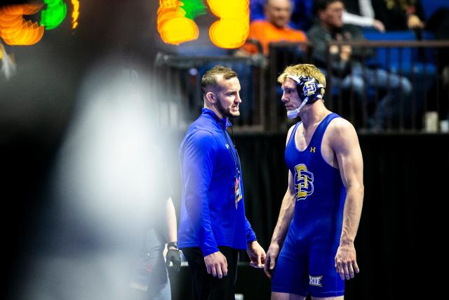 South Dakota State's Tanner Sloan talks with coaches while wrestling at 197 pounds during the first session of the NCAA Division I Wrestling Championships, Thursday, March 16, 2023, at BOK Center in Tulsa, Okla.
