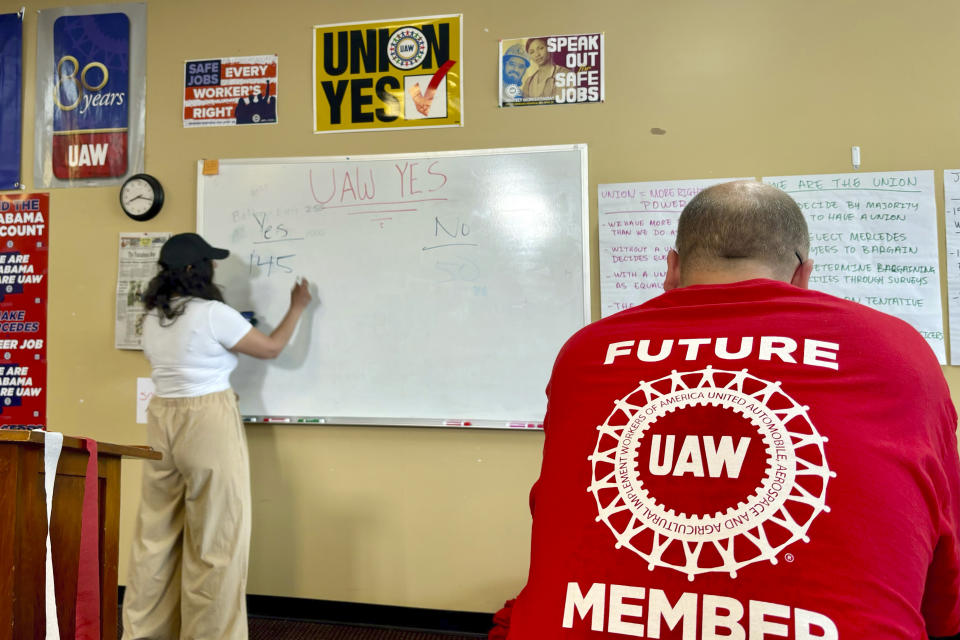 Mercedes worker Rick Webster watches as votes from the union election are reported at the United Auto Workers union field office on May 17, 2024, in Tuscaloosa, Ala. Voting at two Mercedes factories comes a month after the UAW scored a breakthrough victory at Volkswagen's assembly factory in Chattanooga, Tennessee. (AP Photo/Kim Chandler)