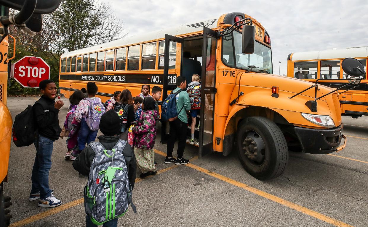 JCPS students change buses at Doss High School on Monday, November 6, 2023