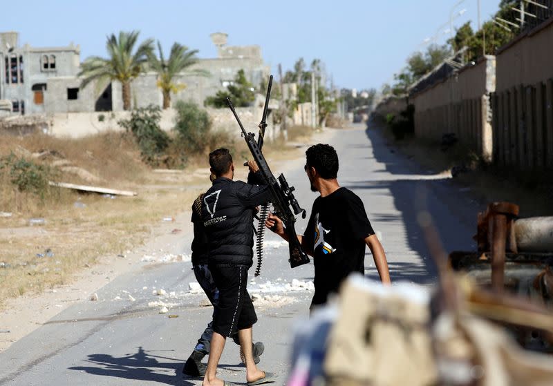 FILE PHOTO: Members of the Libyan internationally recognised government forces are seen during a fight with Eastern forces in al-Yarmouk south of Tripoli