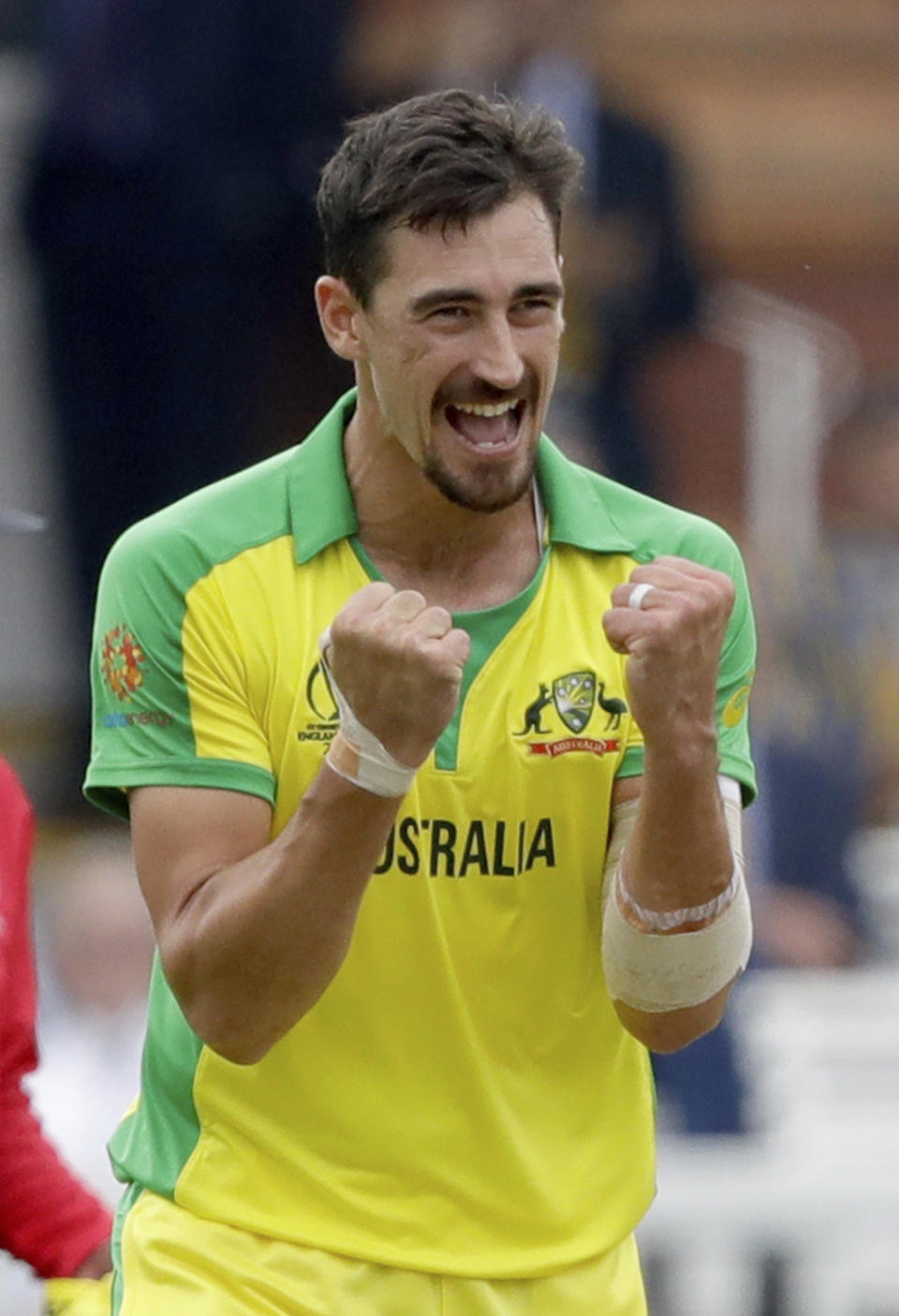 Australia's Mitchell Starc celebrates taking the wicket of England's captain Eoin Morgan during the Cricket World Cup match between England and Australia at Lord's cricket ground in London, Tuesday, June 25, 2019. (AP Photo/Matt Dunham)