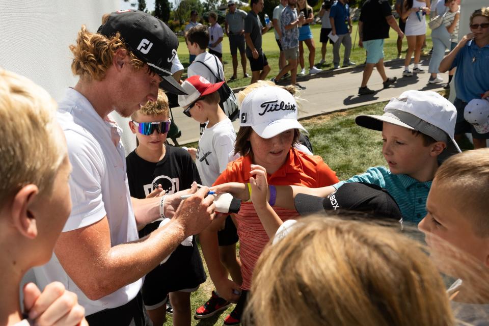 Carson Lundell, of Alpine, signs autographs after finishing the 18th hole during the Utah Championship, part of the PGA Korn Ferry Tour, at Oakridge Country Club in Farmington on Sunday, Aug. 6, 2023. | Megan Nielsen, Deseret News