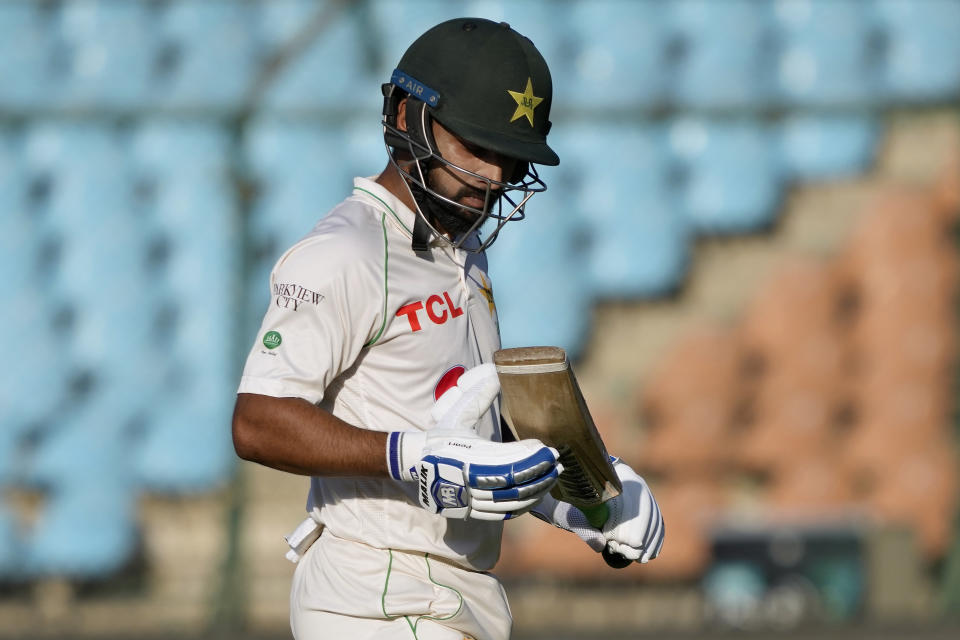 Pakistan's Abdullah Shafique reacts as he walks off the field after his dismissal during the fourth day of first test cricket match between Pakistan and New Zealand, in Karachi, Pakistan, Thursday, Dec. 29, 2022. (AP Photo/Fareed Khan)