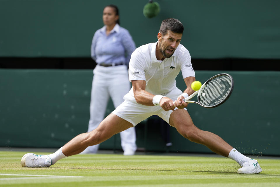 Serbia's Novak Djokovic returns to Spain's Carlos Alcaraz in the final of the men's singles on day fourteen of the Wimbledon tennis championships in London, Sunday, July 16, 2023. (AP Photo/Kirsty Wigglesworth)