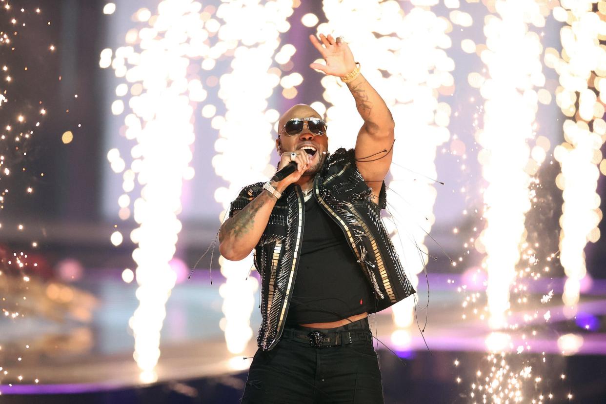 Rapper Flo Rida (C) performs with Senhit Zadik Zadik 'Senhit' of San Marino during the 65th Eurovision Song Contest grand final held at Rotterdam Ahoy on May 22, 2021 in Rotterdam, Netherlands.