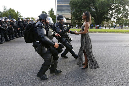 Protestor Ieshia Evans is detained by law enforcement near the headquarters of the Baton Rouge Police Department in Baton Rouge, Louisiana, U.S. July 9, 2016. REUTERS/Jonathan Bachman