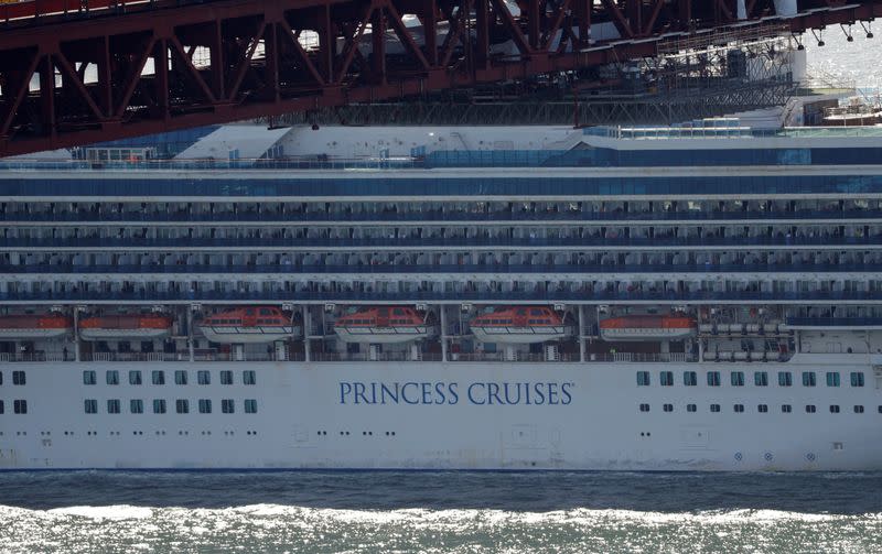 The cruise ship Grand Princess passes the Golden Gate bridge in San Francisco