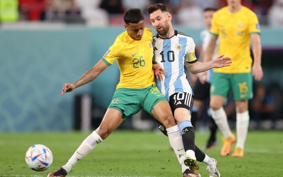 Lionel Messi of Argentina battles for possession with Keanu Baccus of Australia during the FIFA World Cup Qatar 2022 Round of 16 match between Argentina and Australia at Ahmad Bin Ali Stadium - Getty Images