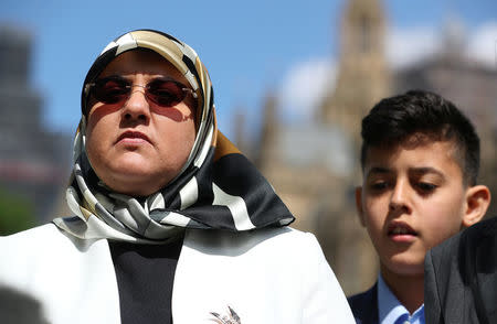 Fatima Boudchar, wife of Libyan politician Hakim Belhadj, makes a statement alongside their son Abderrahim, outside the Houses of Parliament in Westminster, London, Britain, May 10, 2018. REUTERS/Hannah McKay