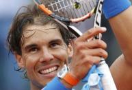 Rafael Nadal of Spain celebrates after beating Quentin Halys of France during their men's singles match at the French Open tennis tournament at the Roland Garros stadium in Paris, France, May 26, 2015. REUTERS/Pascal Rossignol