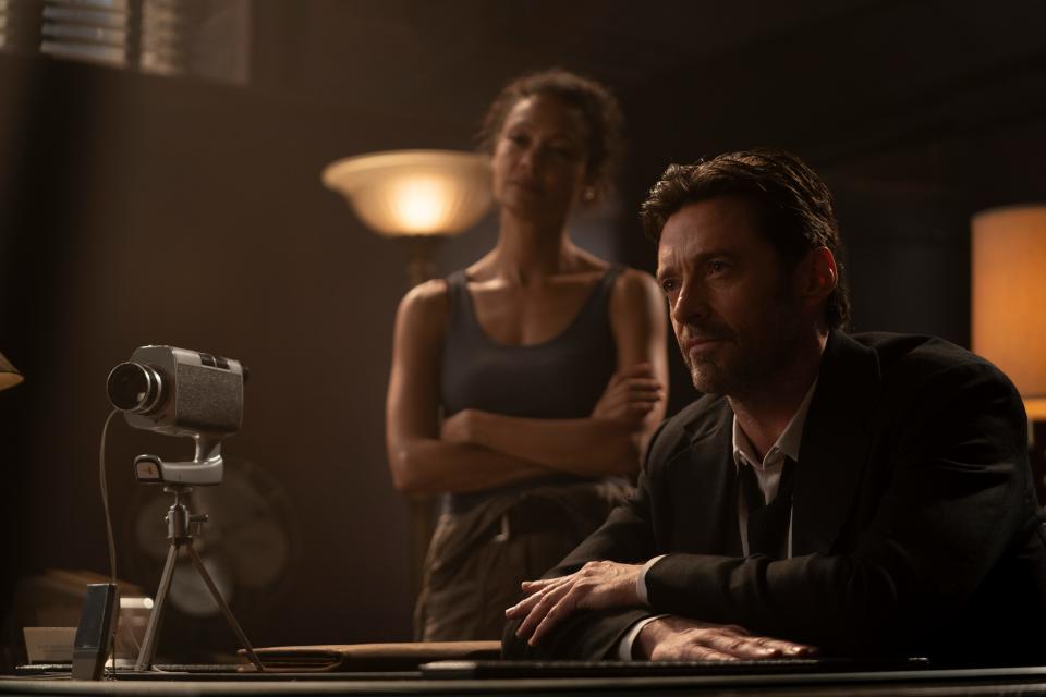 Hugh Jackman (with Thandiwe Newton) is a private investigator who uses a machine to look into the memories of his clients in the sci-fi thriller "Reminiscence."