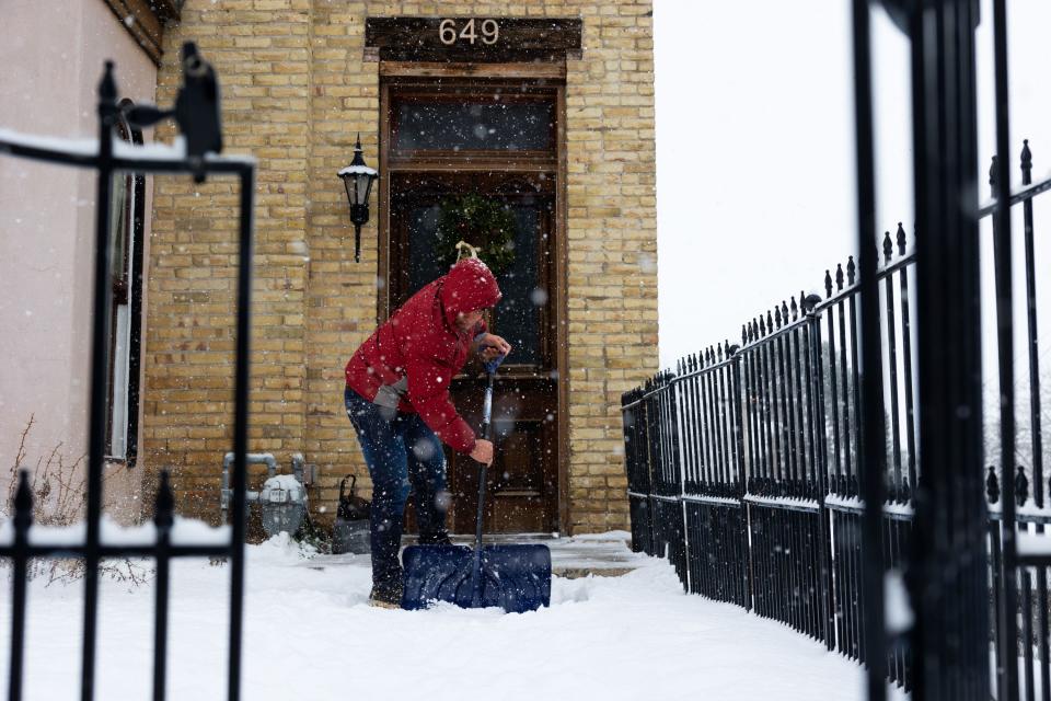 Kendry Jesus shovels his front walkway in Salt Lake City on Thursday, Jan. 11, 2024. Overnight snow blanketed the Wasatch Front. | Megan Nielsen, Deseret News