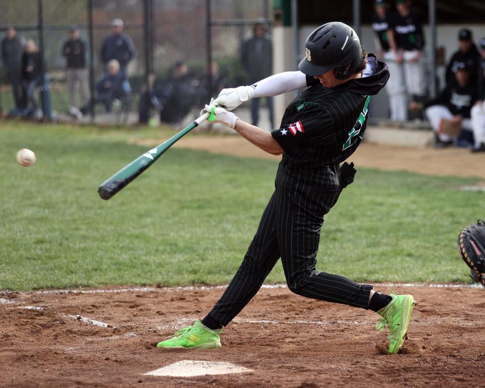Badin center fielder Lucas Moore bats in the game with McNicholas March 30, 2022, at McNicholas.