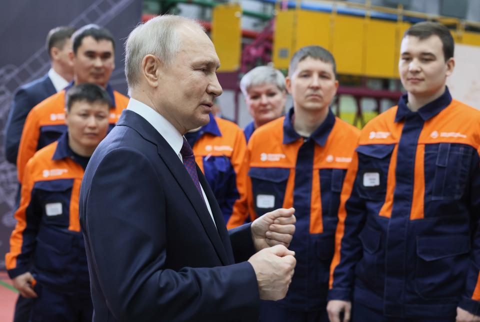 Russian President Vladimir Putin gestures while speaking to employees at an assembly shop of the Ulan-Ude Aviation Plant, a part of the Rostec's Russian Helicopters manufacturing company in Ulan-Ude, Republic of Buryatia, eastern Russia, Tuesday, March 14, 2023. (Mikhail Metzel, Sputnik, Kremlin Pool Photo via AP)