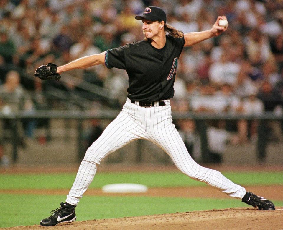 Arizona Diamondbacks starting pitcher Randy Johnson delivers in the fourth inning against the San Diego Padres 25 May 1999 in Phoenix. Johnson pitched the complete game and earned the shut out, allowing six hits and striking out 12, as the Diamondbacks won 4-0.