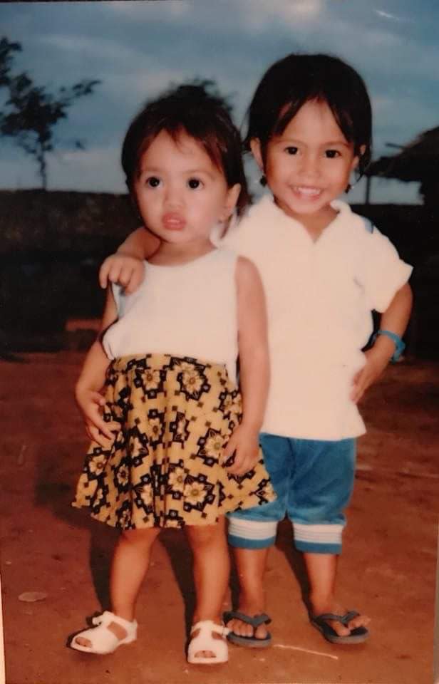Sorassa Soeur, left, and Seyha Chea, her cousin, at a refugee camp in Thailand before the family came to America.