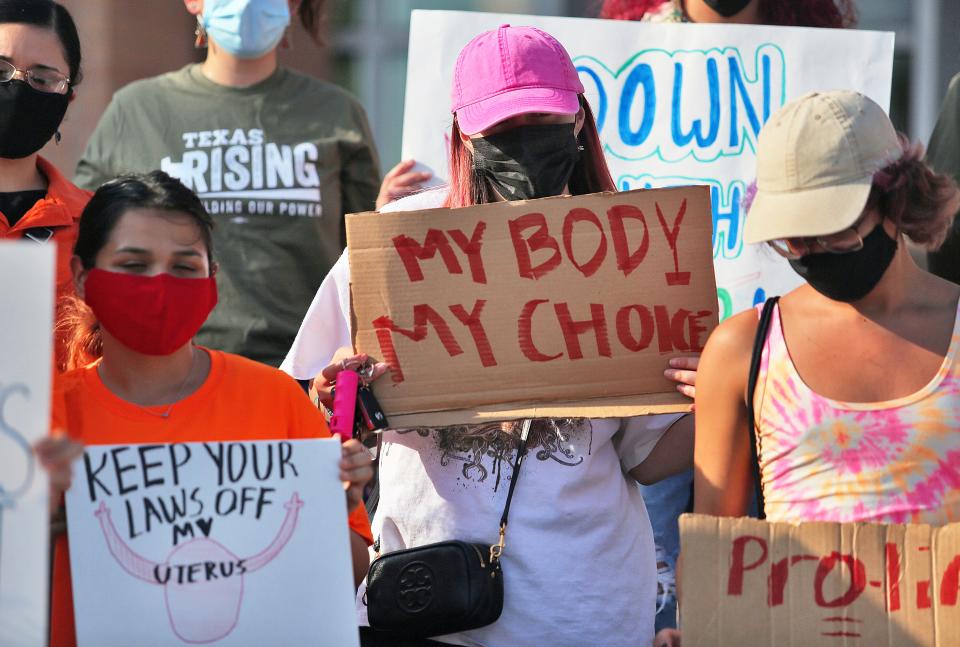 Abortion rights supporters gather to protest Texas SB 8 in front of Edinburg City Hall in Texas. The nation's most far-reaching curb on abortions since they were legalized a half-century ago took effect Wednesday, with the Supreme Court silent on an emergency appeal to put the law on hold.