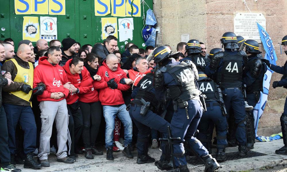 Riot police clash with striking prison guards blocking access to the Baumettes prison in Marseille