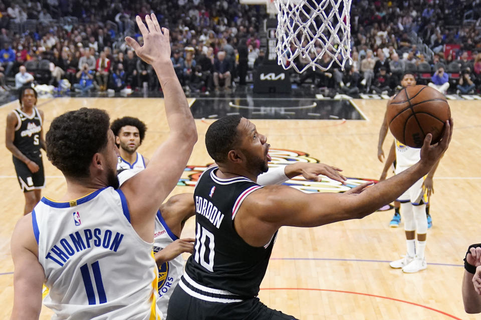 Los Angeles Clippers guard Eric Gordon, right, shoots as Golden State Warriors guard Klay Thompson defends during the first half of an NBA basketball game Tuesday, Feb. 14, 2023, in Los Angeles. (AP Photo/Mark J. Terrill)