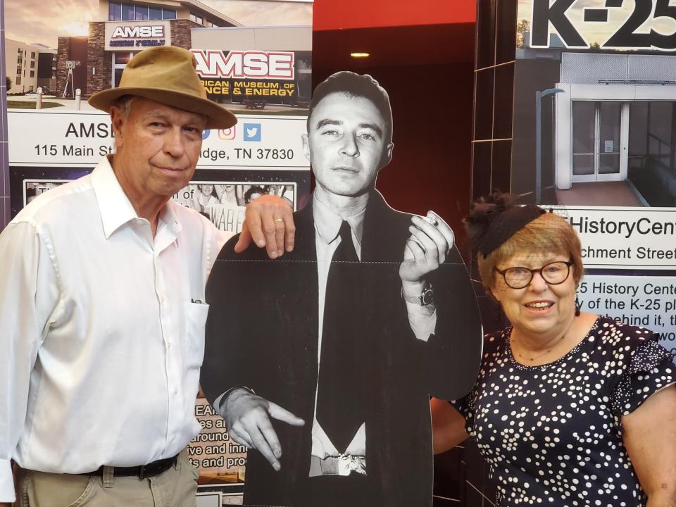 Don and Emily Hunnicutt "time travel" for the premiere of "Oppenheimer at Cinemark's Tinseltown movie theaters in Oak Ridge July 20. They are posing with a standee of Robert Oppenheimer. Emily's father, the late Ed Westcott, took a famous photo of Oppenheimer.