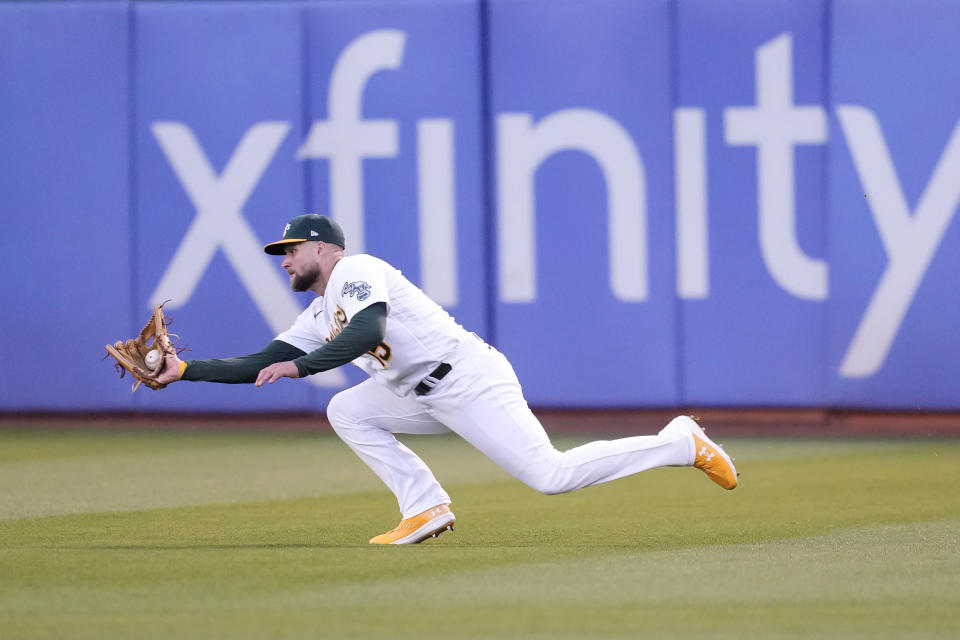 Oakland Athletics right fielder Seth Brown catches a fly out hit by Kansas City Royals' Bobby Witt Jr. during the third inning of a baseball game in Oakland, Calif., Monday, Aug. 21, 2023. (AP Photo/Jeff Chiu)
