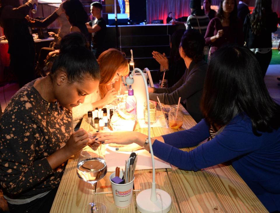 Customers having their nails done at a bar in New York before lockdown (Getty )