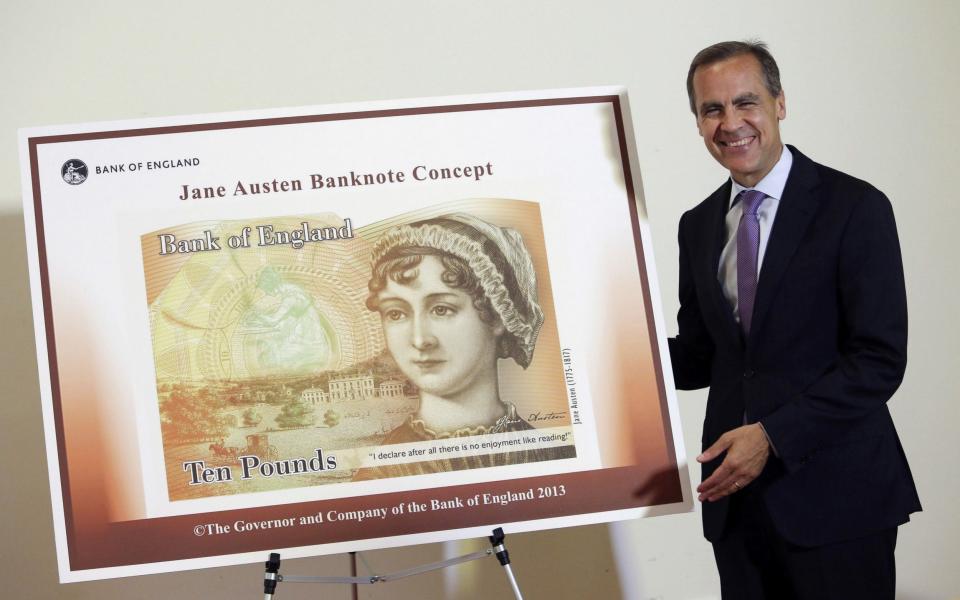 Bank of England governor Mark Carney with the new £10 note which was released today - AFP