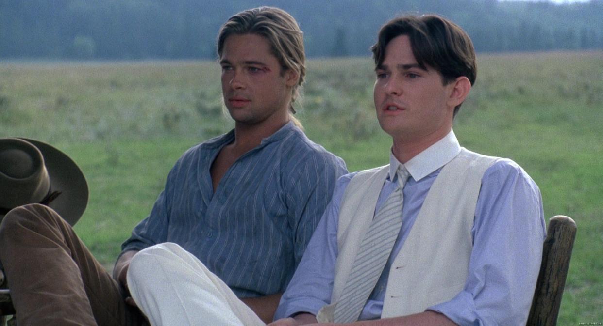 Brad Pitt sitting next to Henry Thomas