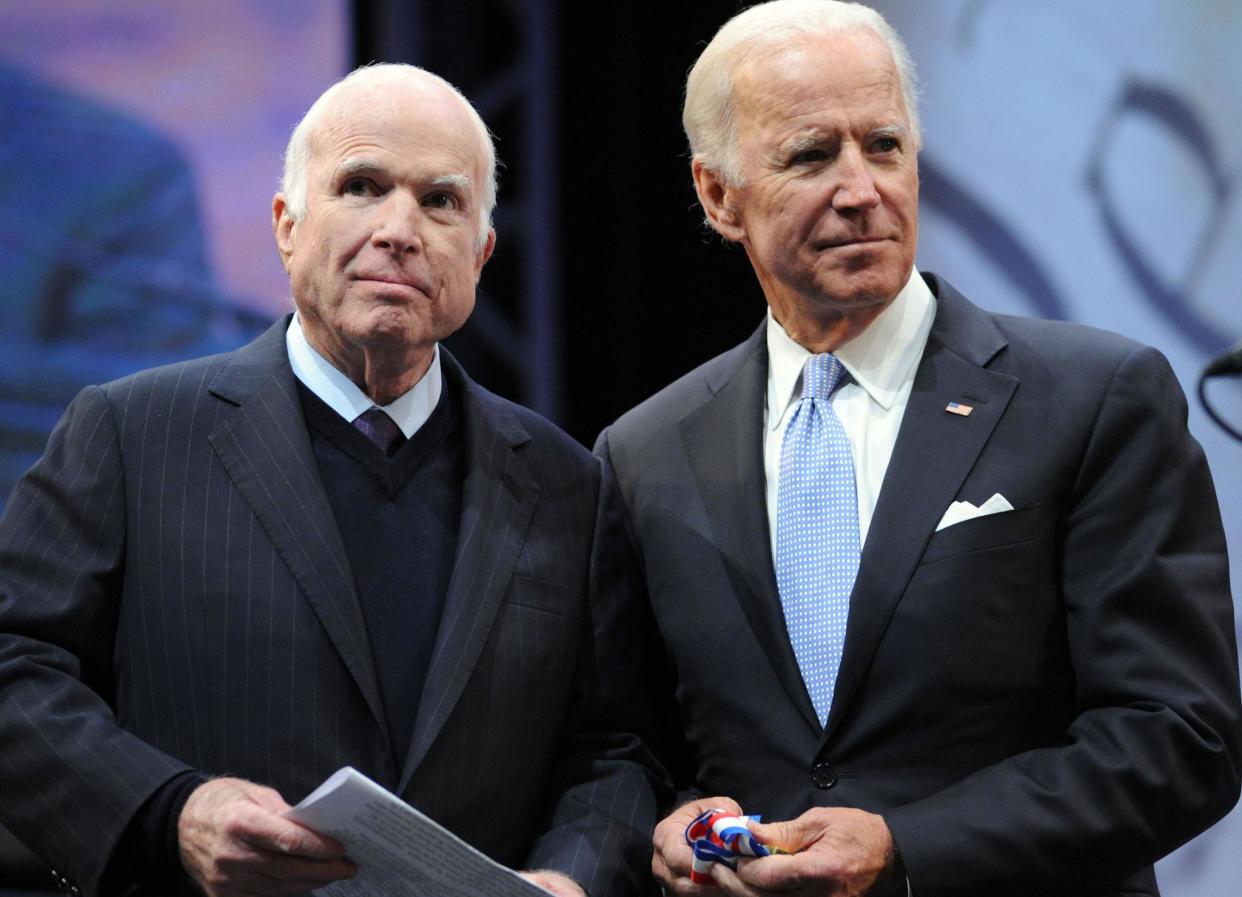 John McCain receives the the 2017 Liberty Medal from former Vice President Joe Biden at the National Constitution Center: Getty Images